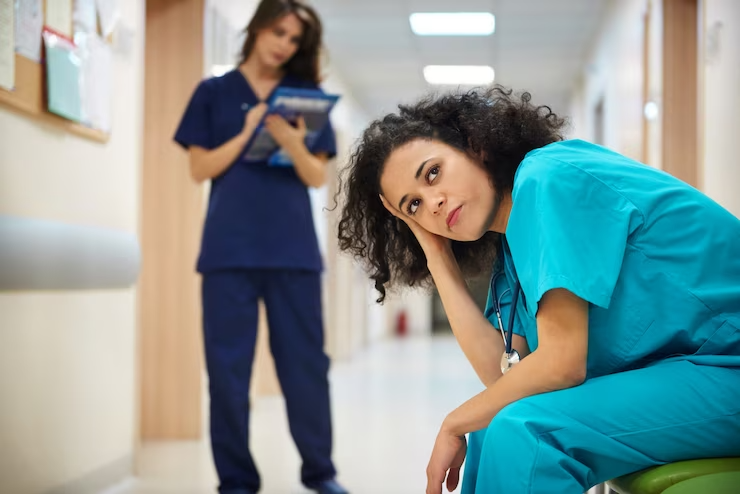 thoughtful-nurse-hospital-corridor