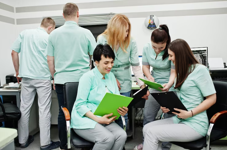 medical-themeobservation-room-with-computer-tomograph-group-female-doctors-with-clipboards-meeting-mri-office-diagnostic-center-hospital